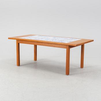 A teak coffee table with inlaid tiles. Second half of the 20th Century.