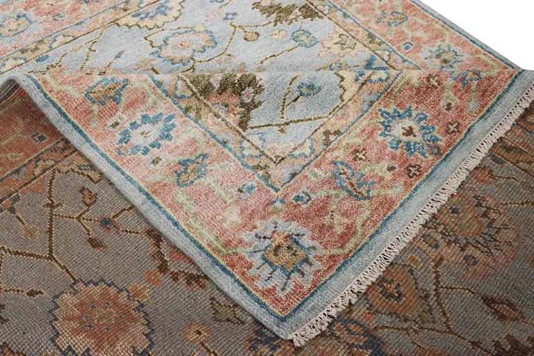 An oriental carpet with Mamluk design, c. 302 x 252 cm.