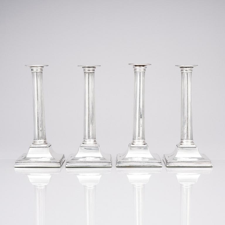 Four English 18th century silver candlesticks, mark of Young, Greaves & Hoyland, Sheffield 1780.