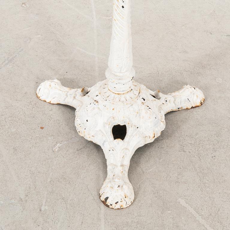 A marble and cast iron table 20th century.