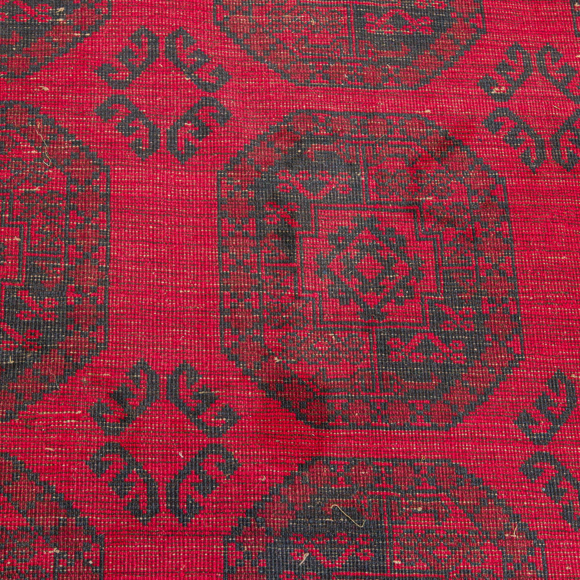 Two Afghan carpets. Ca. 326 x 217 and 88 x 63 cm.