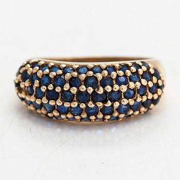 A 14K gold ring with sapphires.