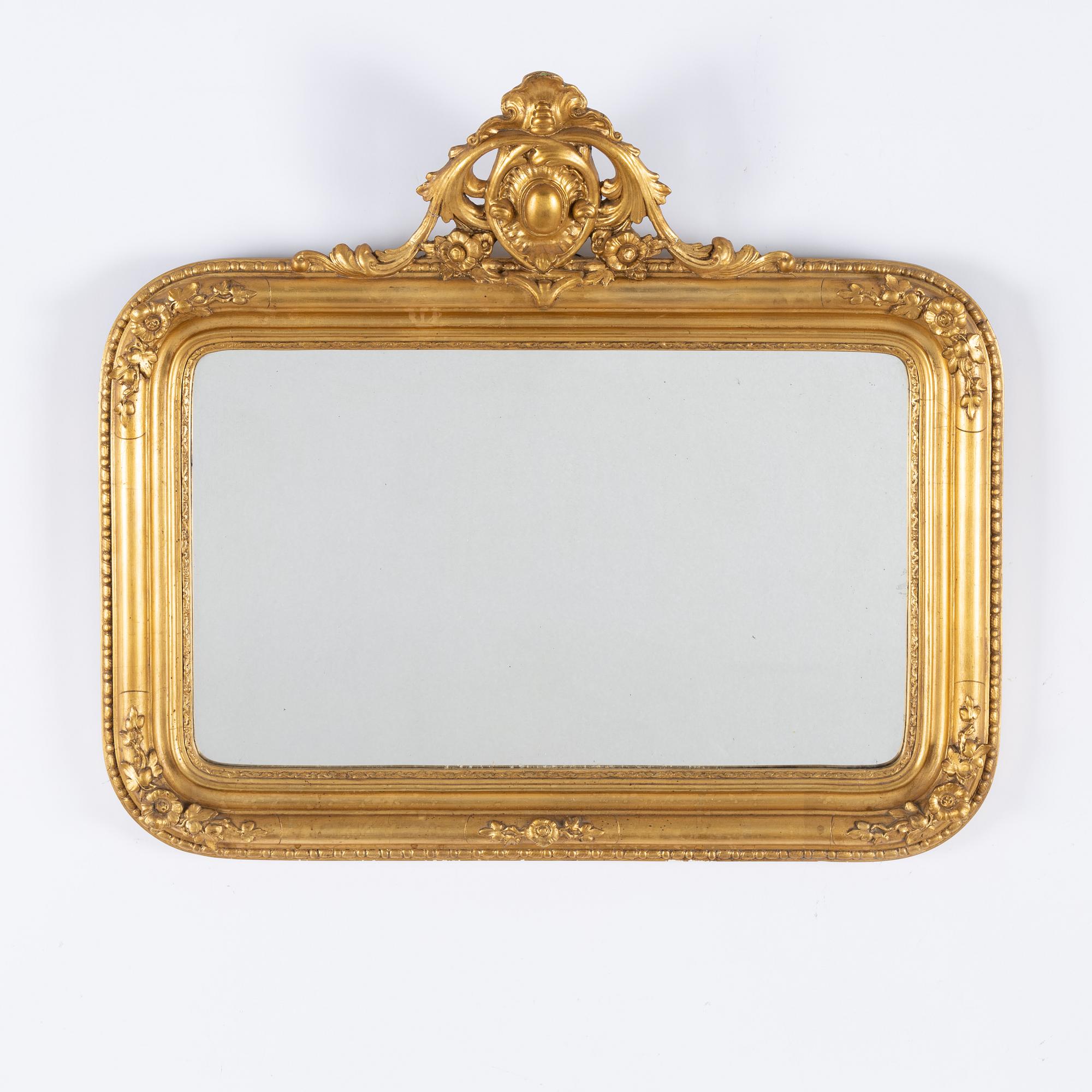 A gesso rococo-revival mirror, later part of the 20th Century.
