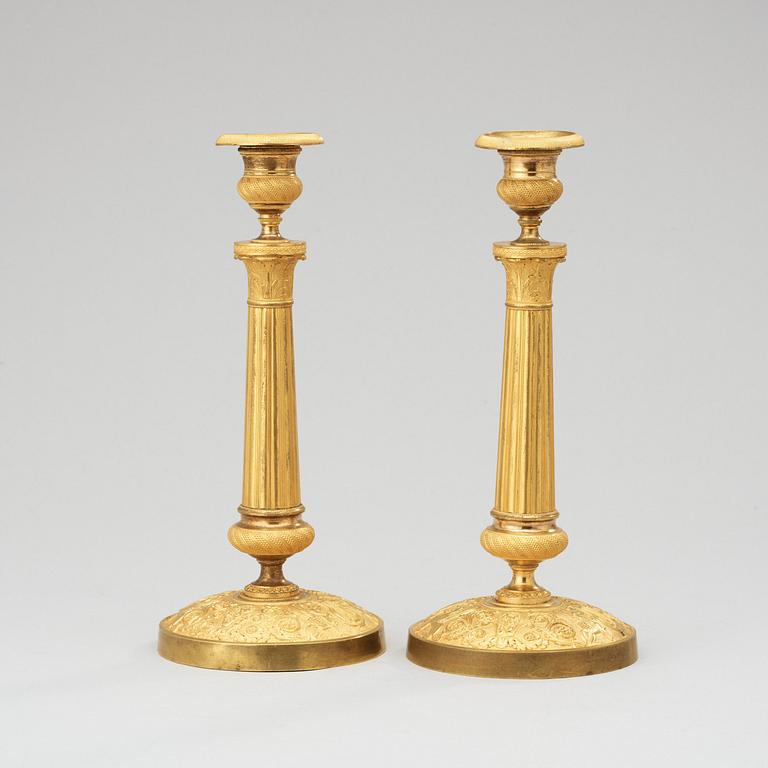 A pair of French Empire early 19th century candlesticks.