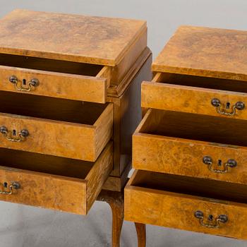 A pair of Rococo-style bedside tables.