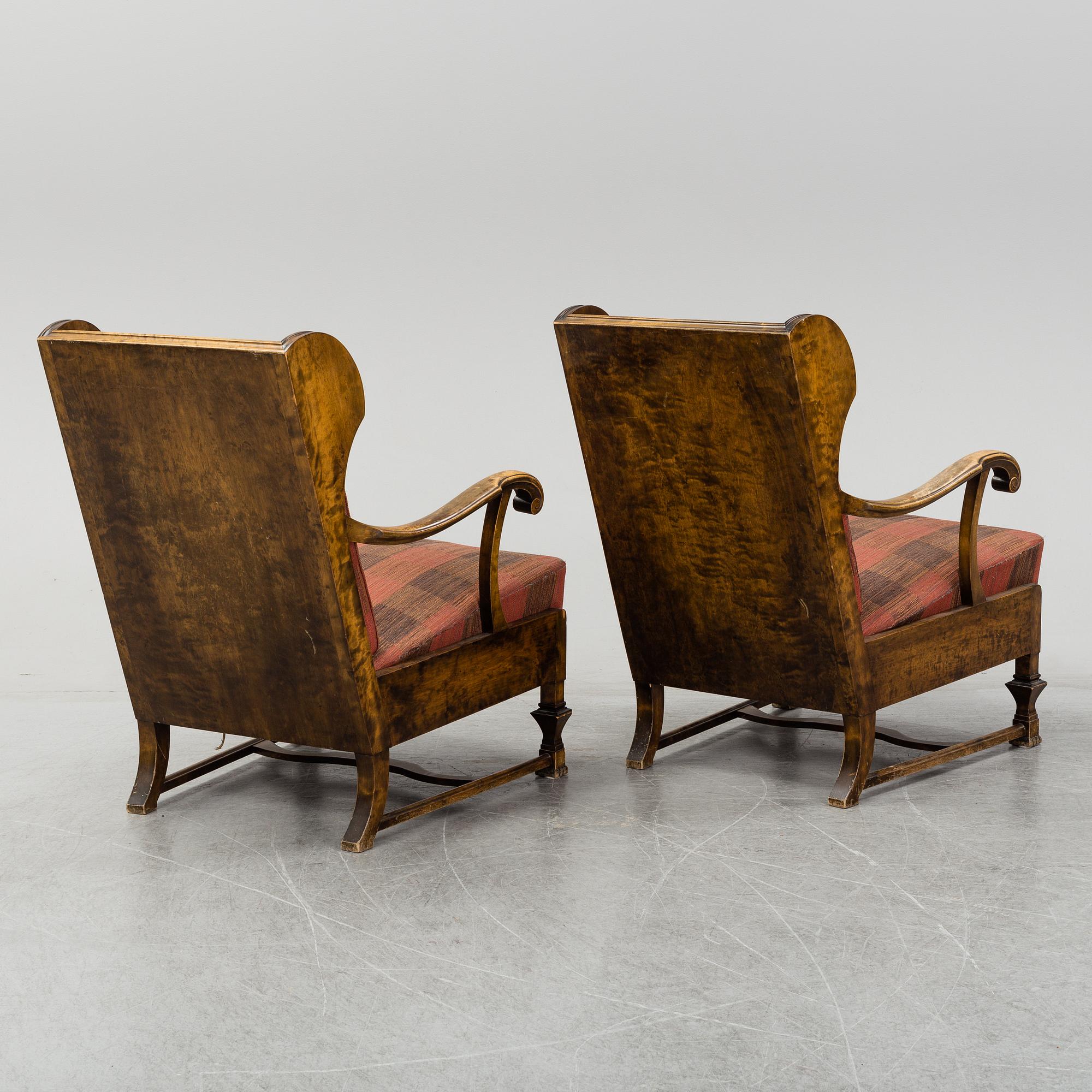 A pair of 1920s easy chairs.