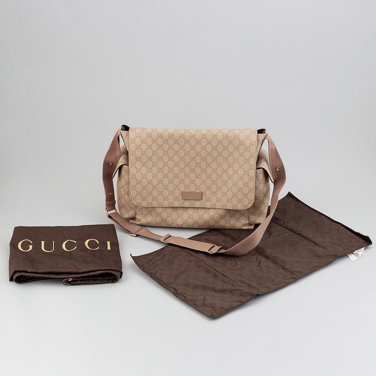Gucci, skötväska.