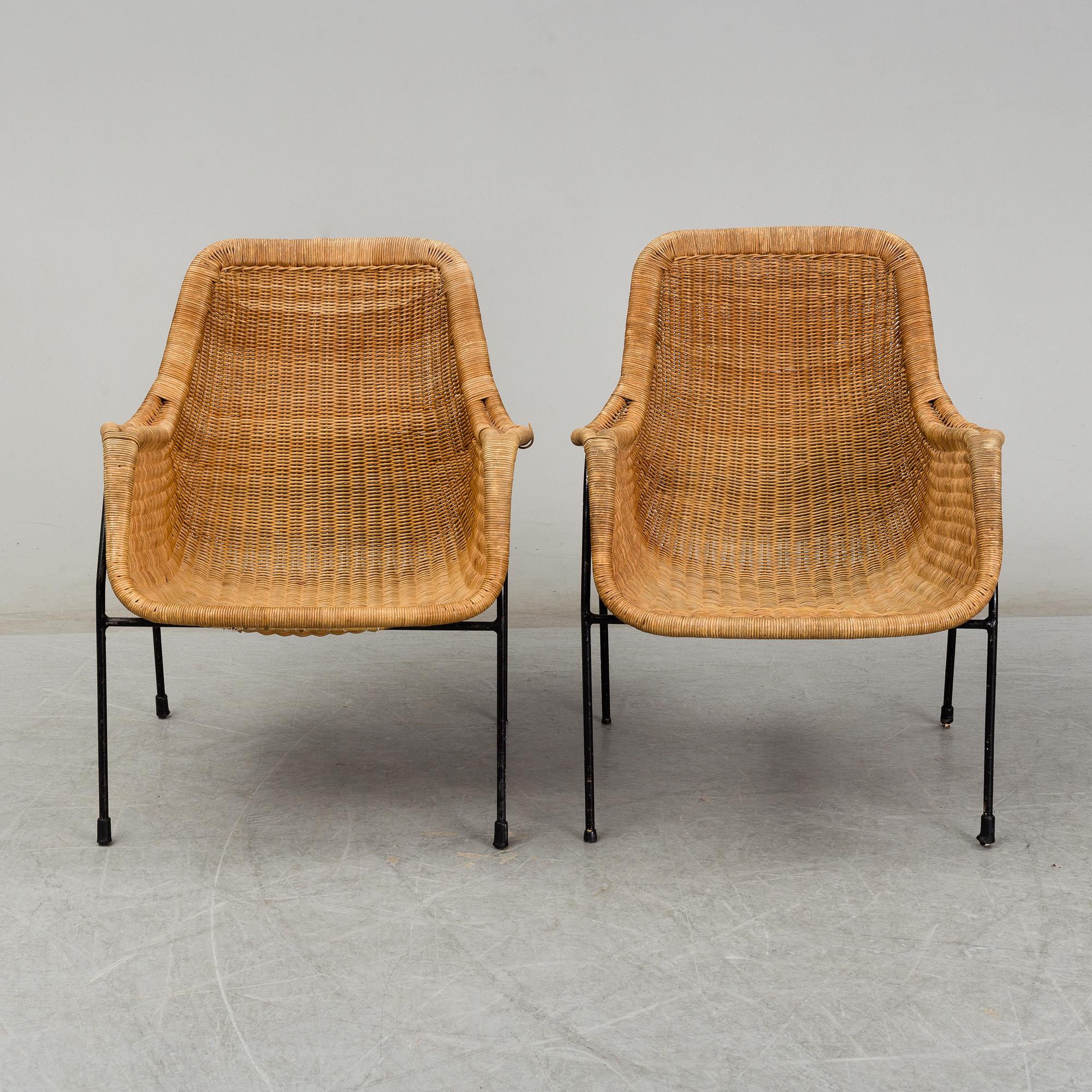 A 1950's pair of rattan easy chairs.