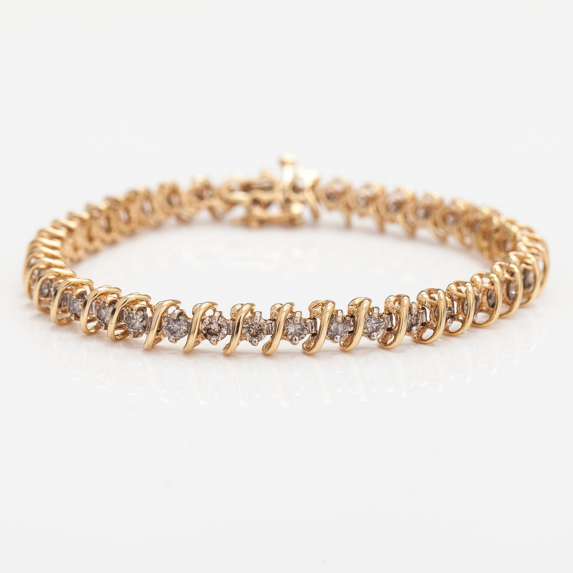 A 14K gold bracelet with light brown diamonds ca. 2.38 ct in total.