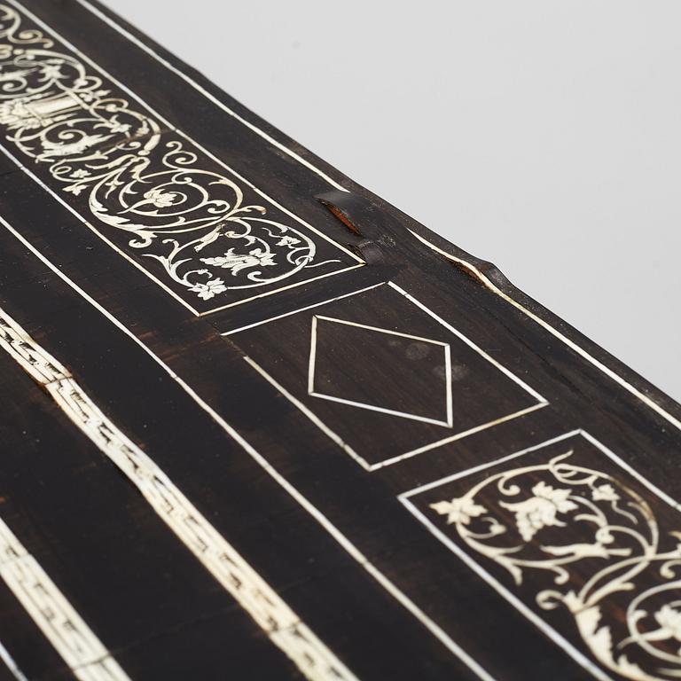 A Renaissance-style ebony, ebonized and ivory-inlaid library table, late 19th century, presumably Germany.