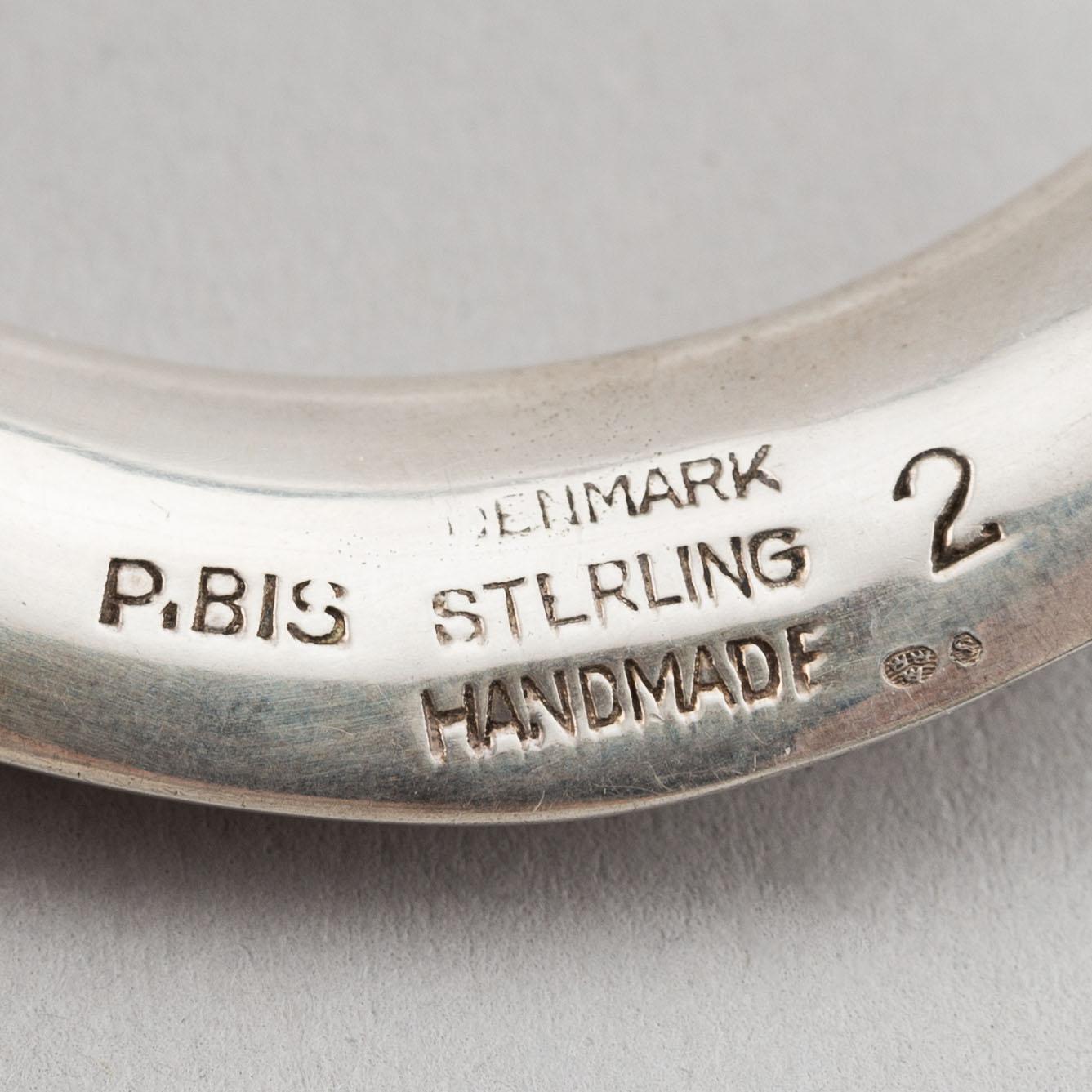 Two silver bracelets, including Denmark.