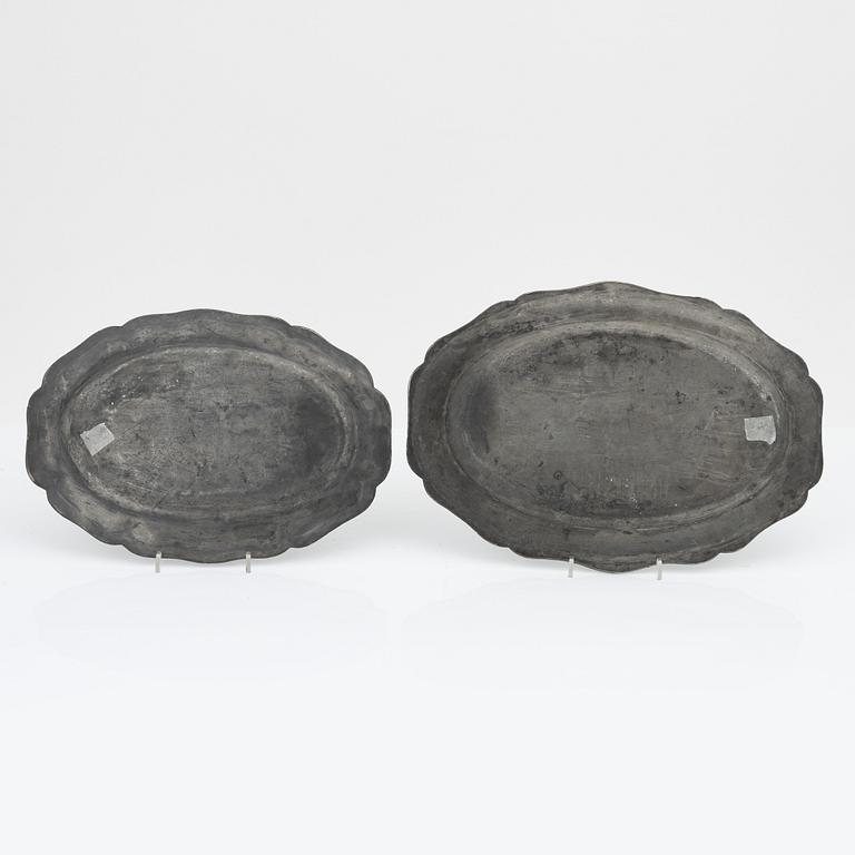 A set of six rococo pewter trays, mid 18th Century.