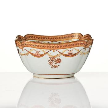 An oval vegetable tureen with cover and a pillow shaped bowl, Qing dynasty, late 18th century.