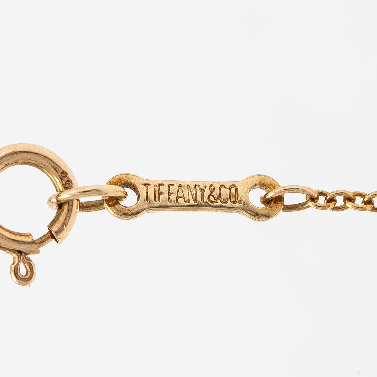 Tiffany & Co, Elsa Peretti, an 18K gold 'Open Heart' necklace with small diamonds.