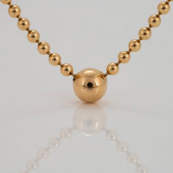 A Cartier "Pluie de Diamants" 18K gold necklace with a round brilliant-cut diamond.