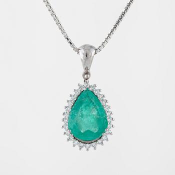 An emerald and brilliant cut diamond pendant.