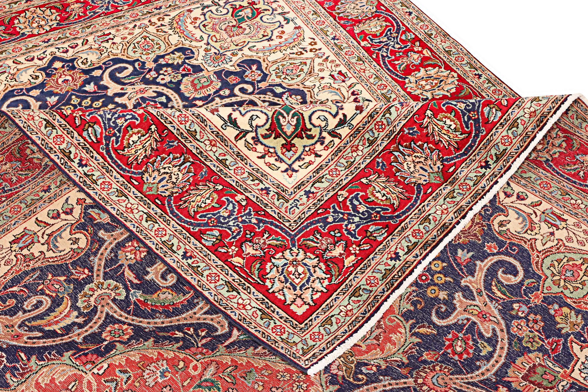 A Tabriz carpet, c. 345 x 255 cm.