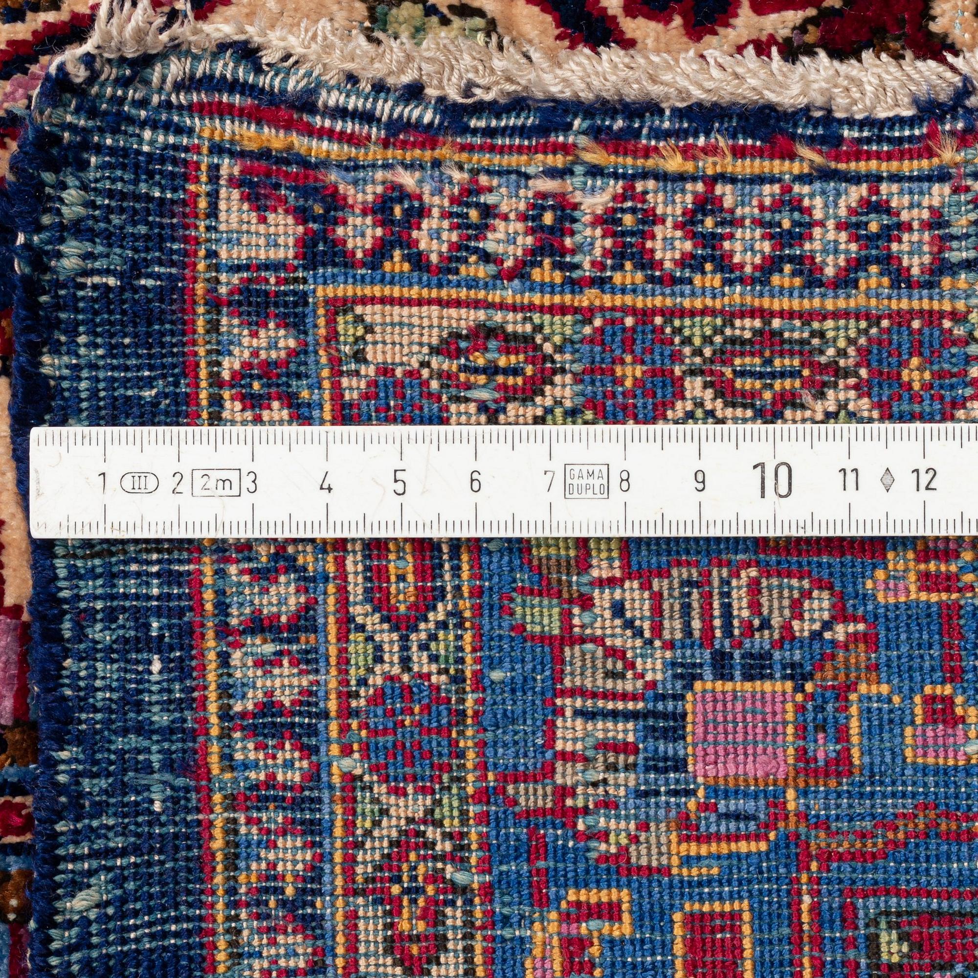 An antique silk Kashan carpet, central Persia (Iran) c. 378 x 259 cm.