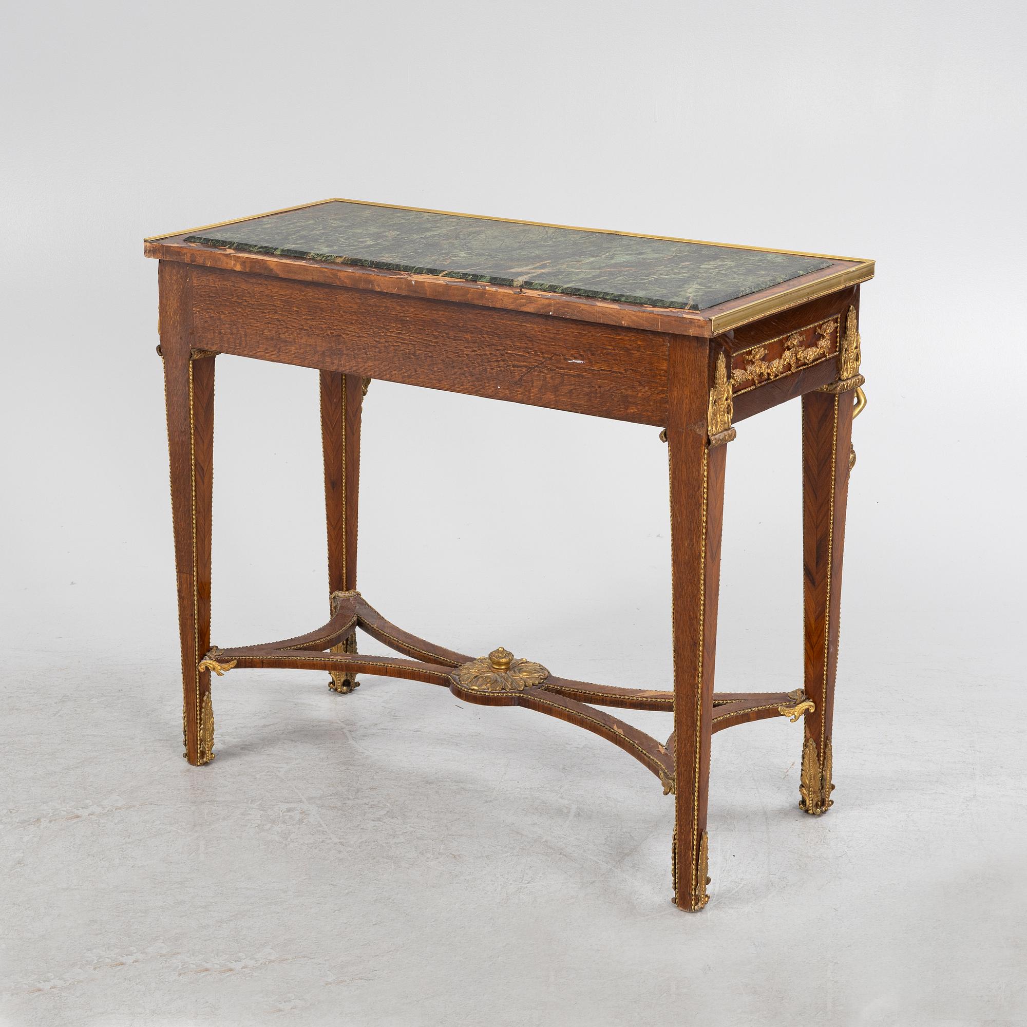 A Louis XVI-style gilt-brass mounted console table, circa 1900.