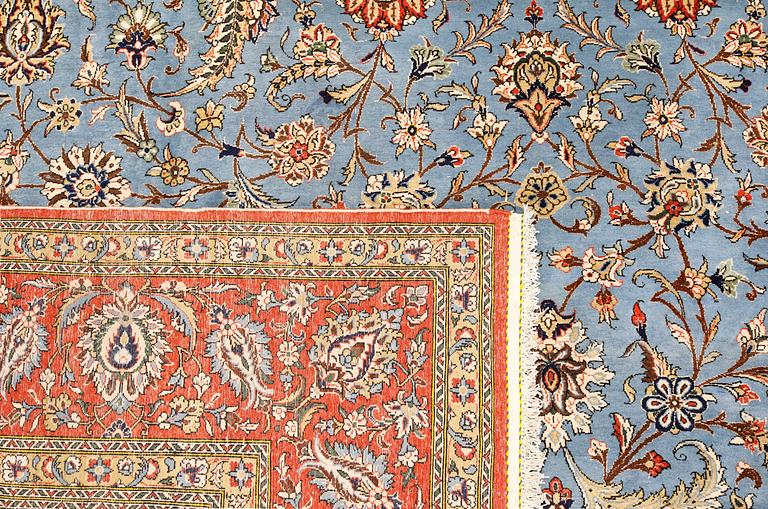 A Ghom carpet, part silk, approx. 480 x 350 cm.