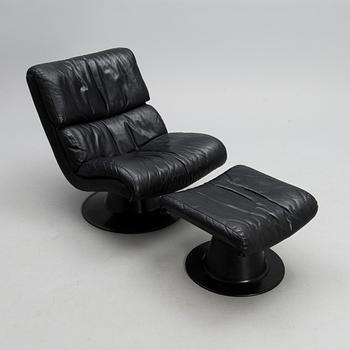 YRJÖ KUKKAPURO, AN ARMCHAIR AND OTTOMAN. Saturnus. Manufactured by Haimi, 1970s.