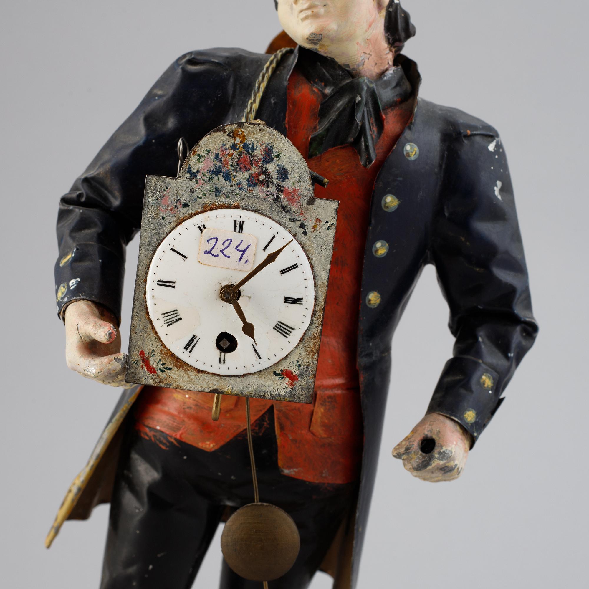 A Black Forest sheet metal figural timepiece, second half of the 19th century.