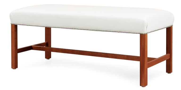 A Josef Frank cherry wood stool by Svenskt Tenn, model 2082.