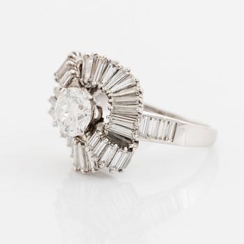 A Boucheron platinum ring set with a round brilliant-cut diamond weight ca 1.25 cts quality ca H vvs.