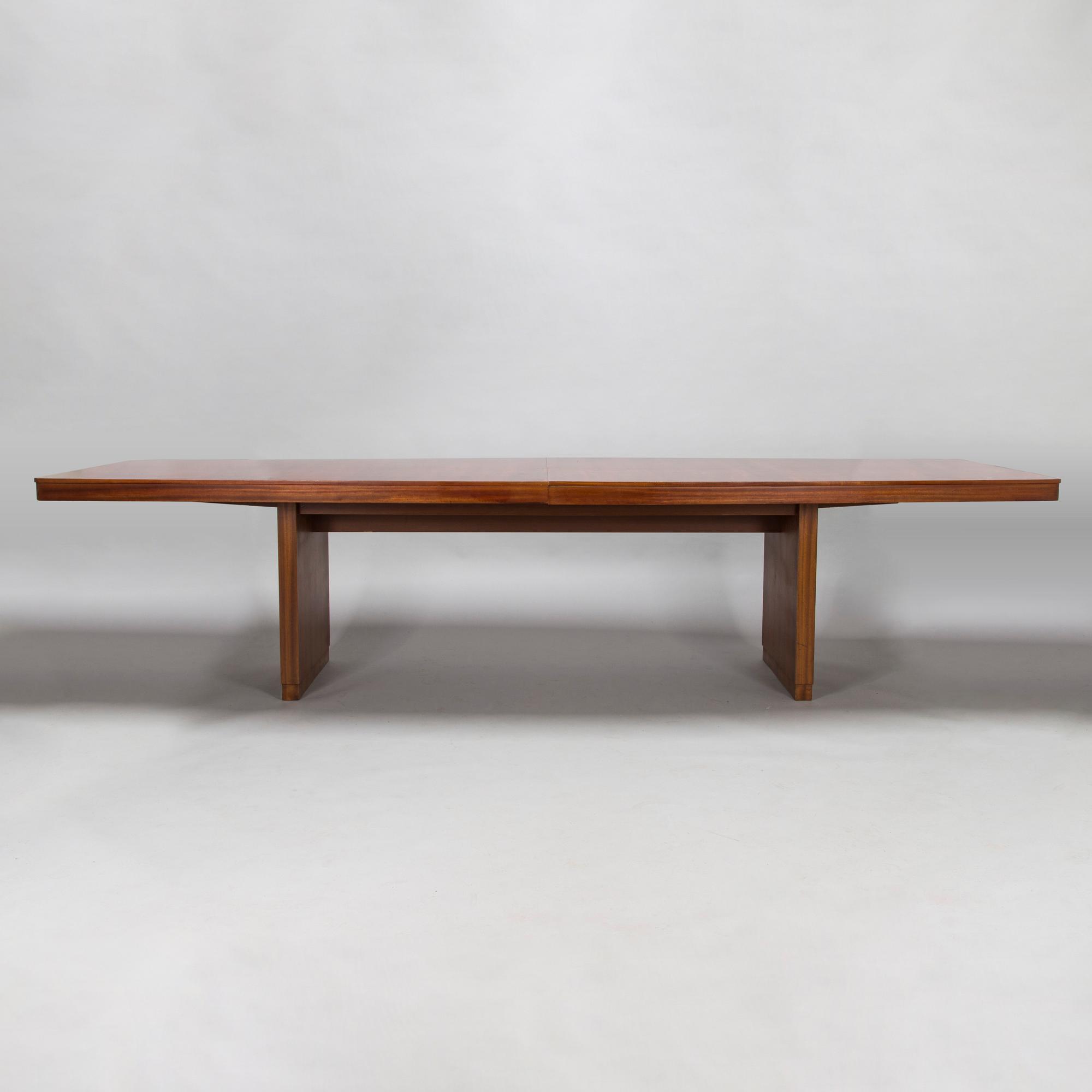 A mid 20th century conference table / dinner table marked Paul Boman.