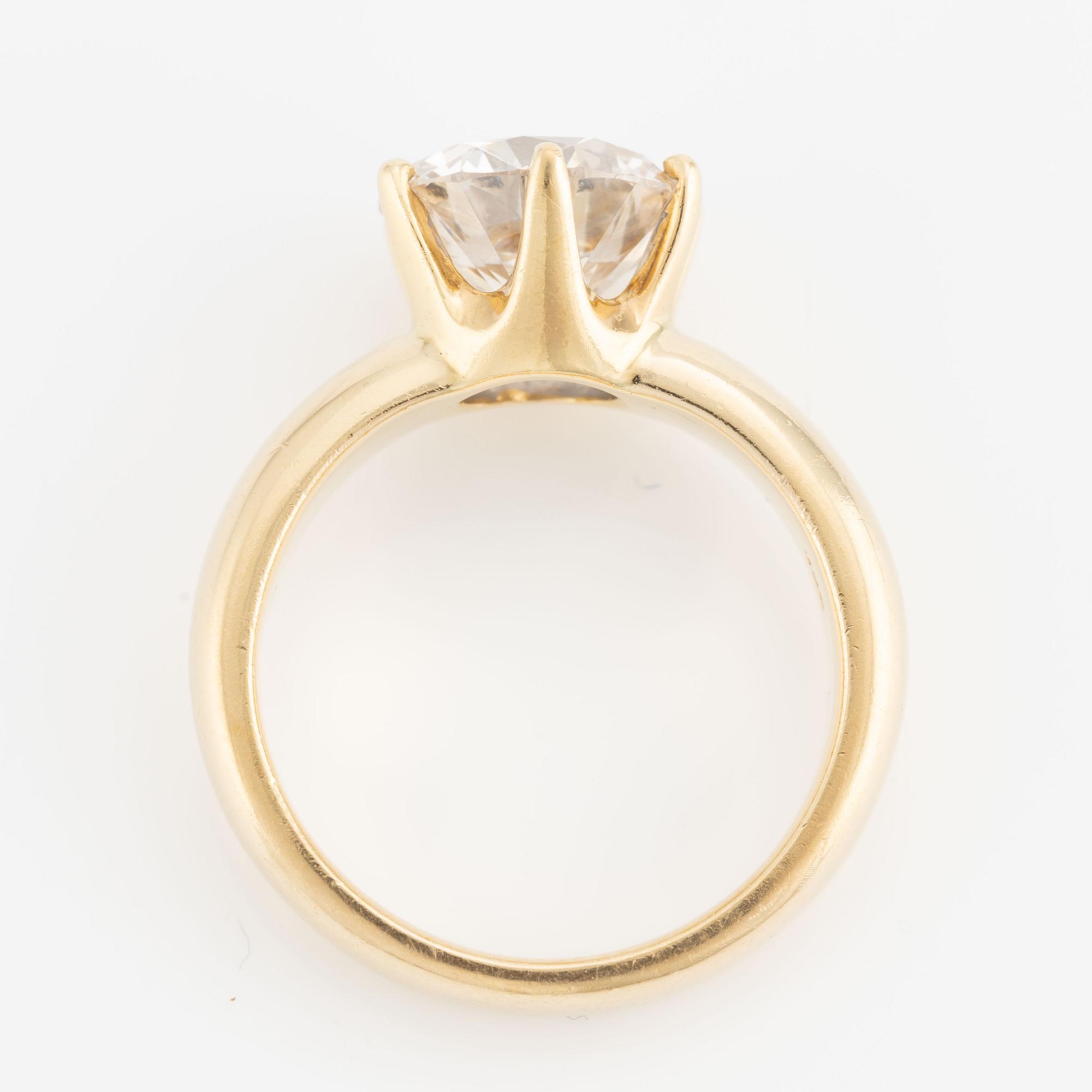 Ring, 18K gold with a round brilliant-cut diamond.