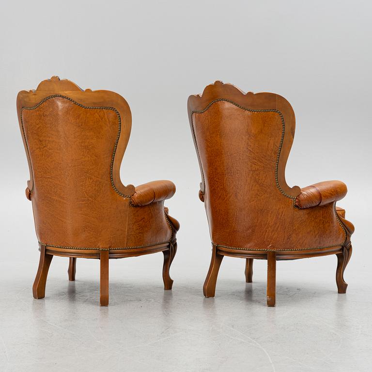 A pair of leather armchairs, second half of the 20th century.