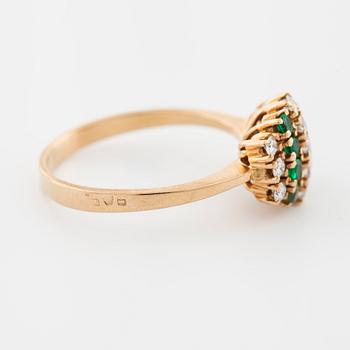 An emerald and brilliant cut diamond ring.