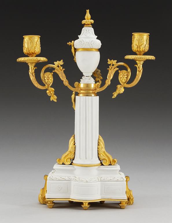 A gilt bronze bisquit candelarbrum, Porcelain de Paris, period of Achille Bloch ca 1910.