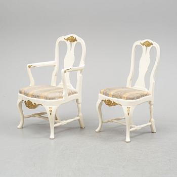 A dining table and six chairs, rococo style, mid 20th century.