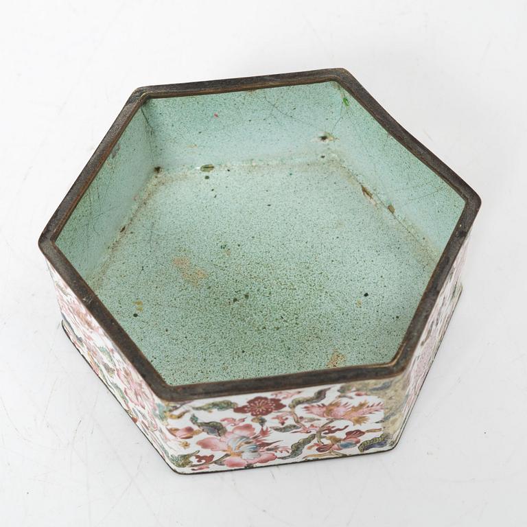 A Chinese enamel on copper teapot and an enamel box with carved wooden cover, Qing dynasty, 18th century.