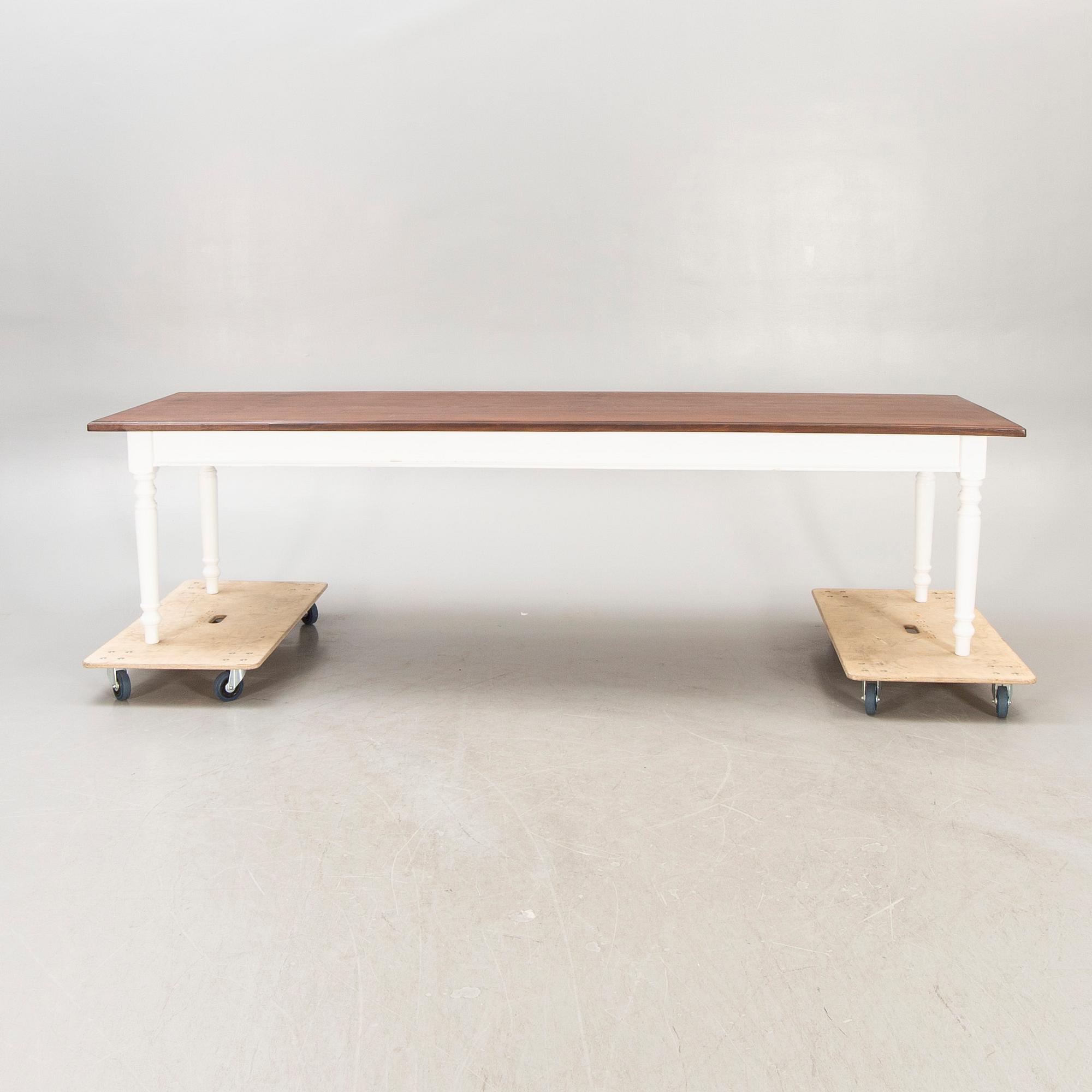 A painted and stained table 21st century.