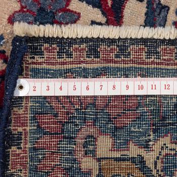 An oriental carpet, approx. 411 x 326 cm.