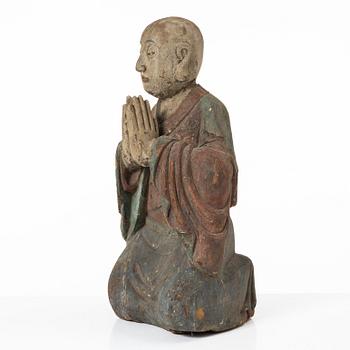 A Chinese sculpture of a louhan, 20th century.