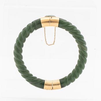 Arm ring, green stone and clasp in 14K gold.