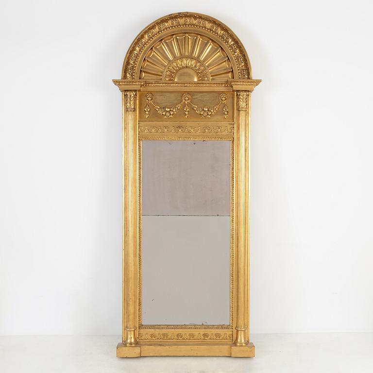 An Empire mirror, first half of the 19th Century.