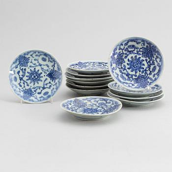 A set of 12 similar Chinese blue and white porcelain small dishes, late Qing dynasty, around the year 1900.
