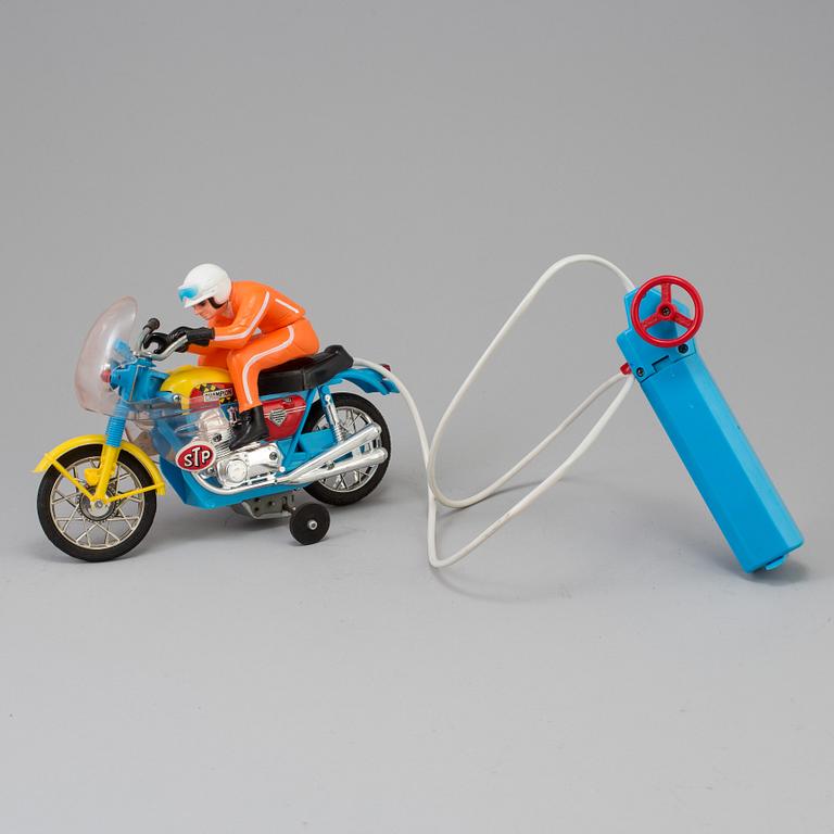 A 1970s battery operated toy racing auto cycle,Original "Junior" Product, Japan.