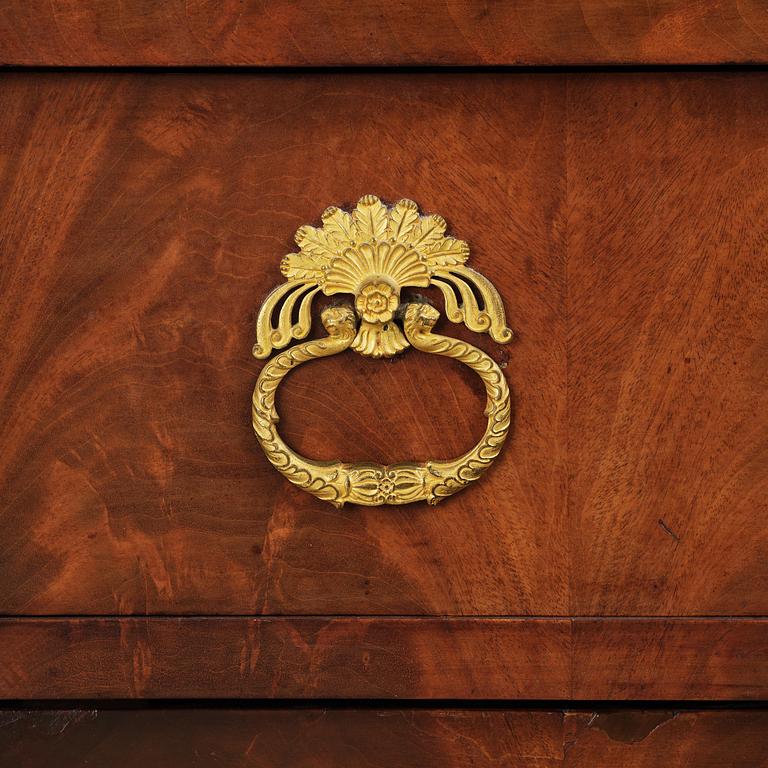 A French Empire mahogany commode, early 19th century.
