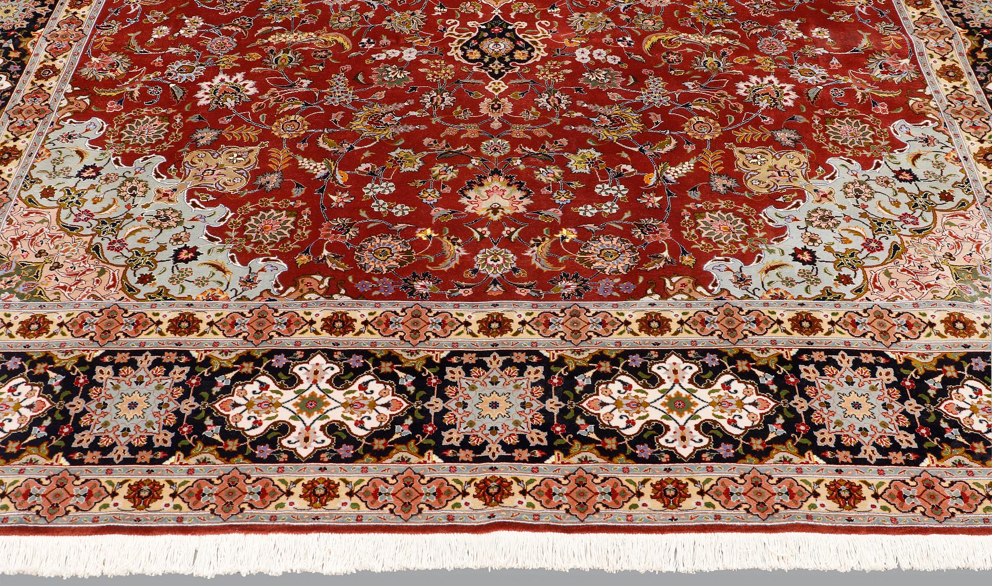 A Tabriz carpet, part silk, so-called 50 Raj, approx. 352 x 250 cm.