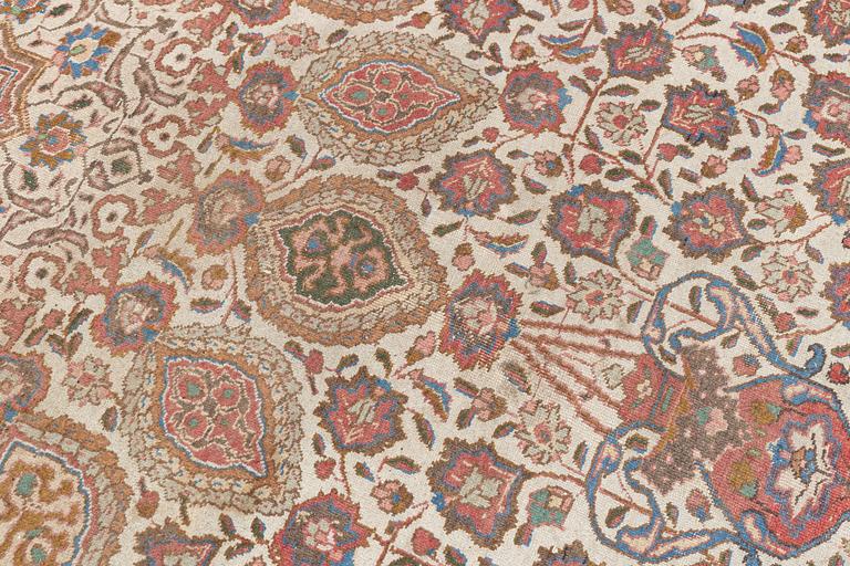 A Tabriz carpet, c. 390 x 305 cm.