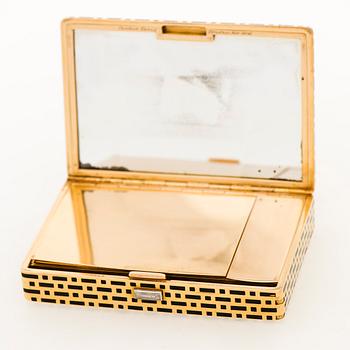 A CARTIER VANITY CASE, 18K gold, enamel, baguette cut diamond. France 1930s.