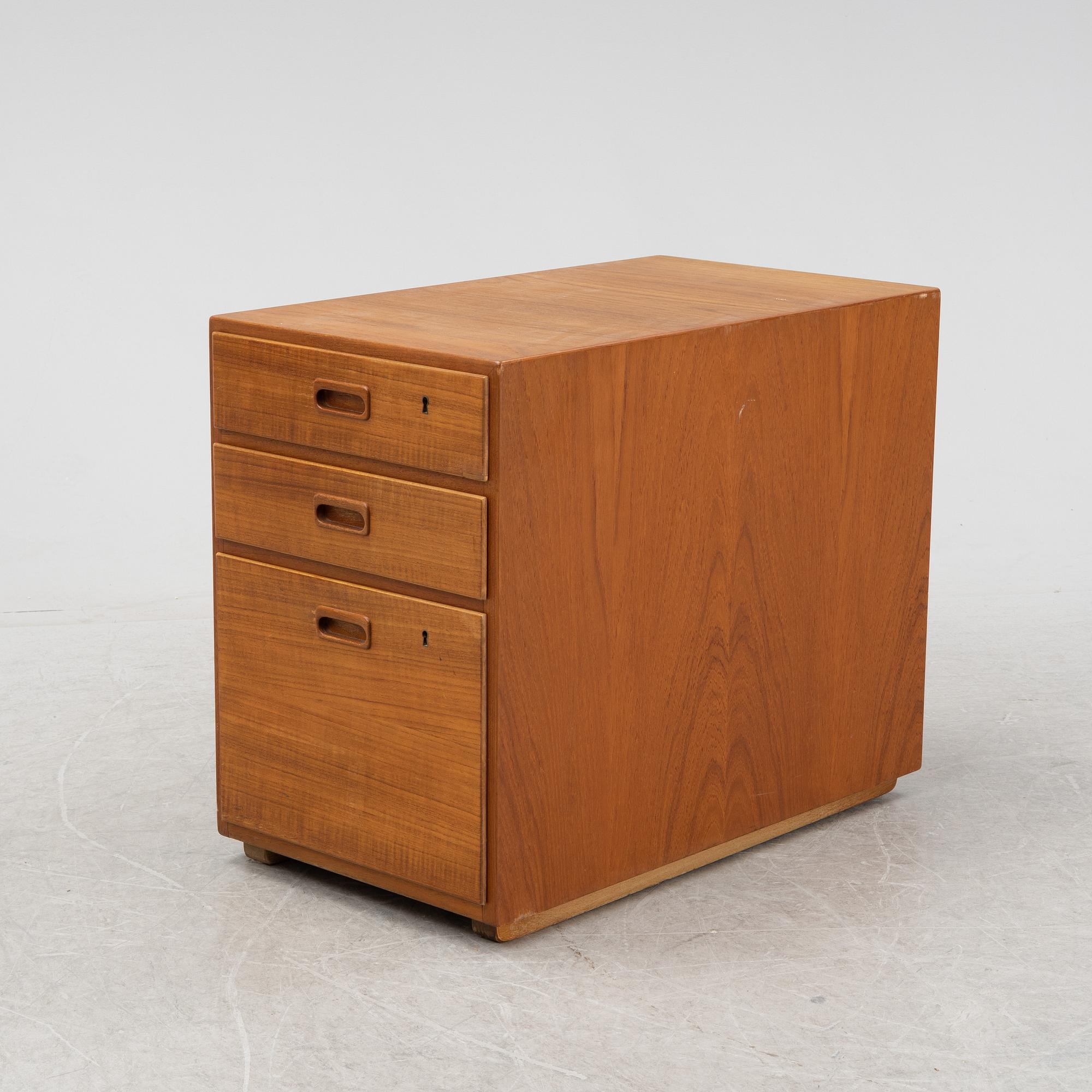 A desk with a drawer unit, Bra Bohag, Hugo Troeds, Bjärnu, mid 20th Century.