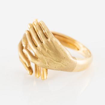 Ring, 18K gold in the form of hands, set with carré-cut rubies.