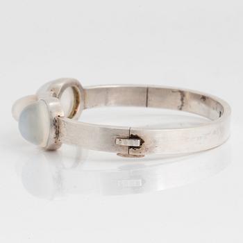 Wiwen Nilsson, a sterling silver bangle with three cabochon cut moonstones, Lund, Sweden 1938.