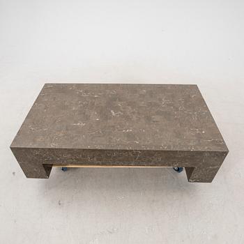 A late 20th century travertine coffee table.